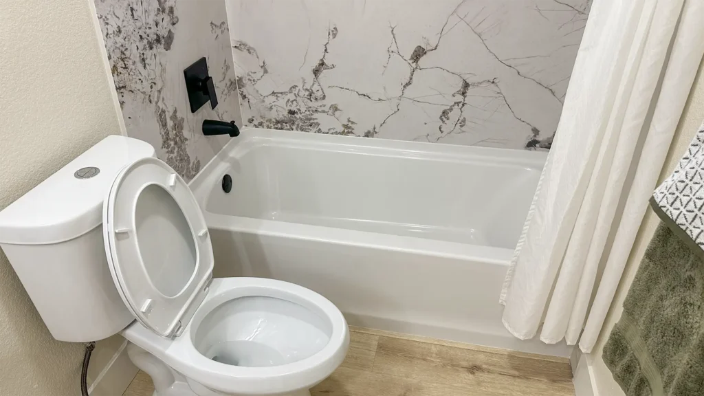 Bathroom remodel featuring niche shelves and custom storage solutions to maximize function and aesthetics in Sacramento, CA by Tenax Construction