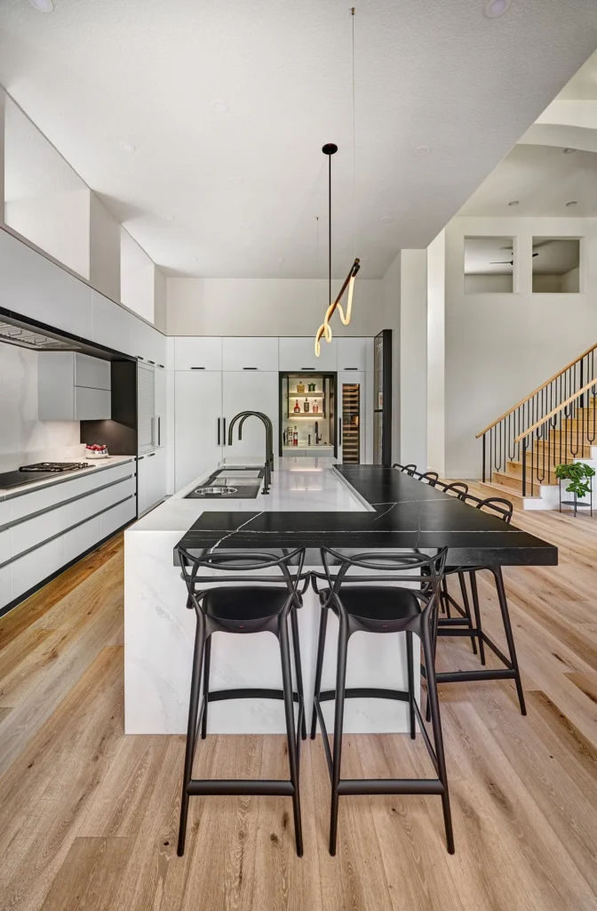 Blanc and Noir kitchen remodel featuring built-in wet bar with wine column illuminated glass display and undercounter sink in Sacramento, CA by Tenax Construction