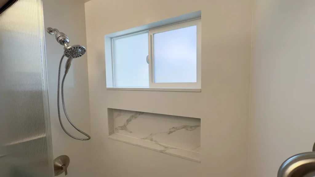 Elegant bathroom remodel featuring prefabricated quartz countertop with undermount sink for sleek modern finish in Fair Oaks, CA by Tenax Construction