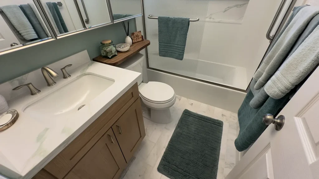 Elegant bathroom remodel featuring full demolition of old bathtub shower enclosure vanity toilet and flooring in Fair Oaks, CA by Tenax Construction