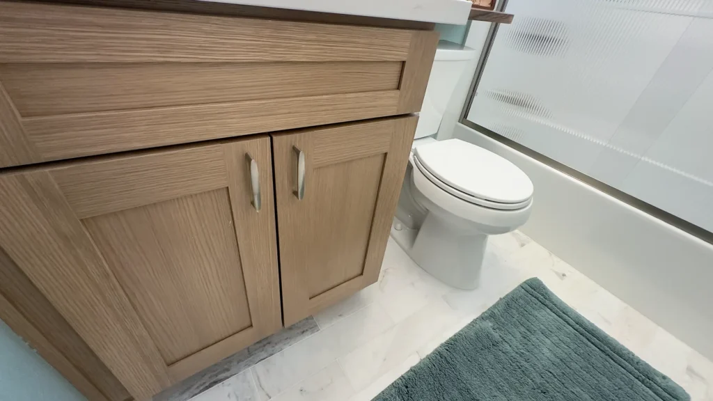 Elegant bathroom remodel featuring oversized medicine cabinet and grab bar with stylish brushed nickel hardware in Fair Oaks, CA by Tenax Construction