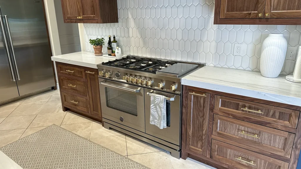 Elegant kitchen remodel featuring homeowner-selected pendant lights illuminating kitchen island in Granite Bay, CA by Tenax Construction