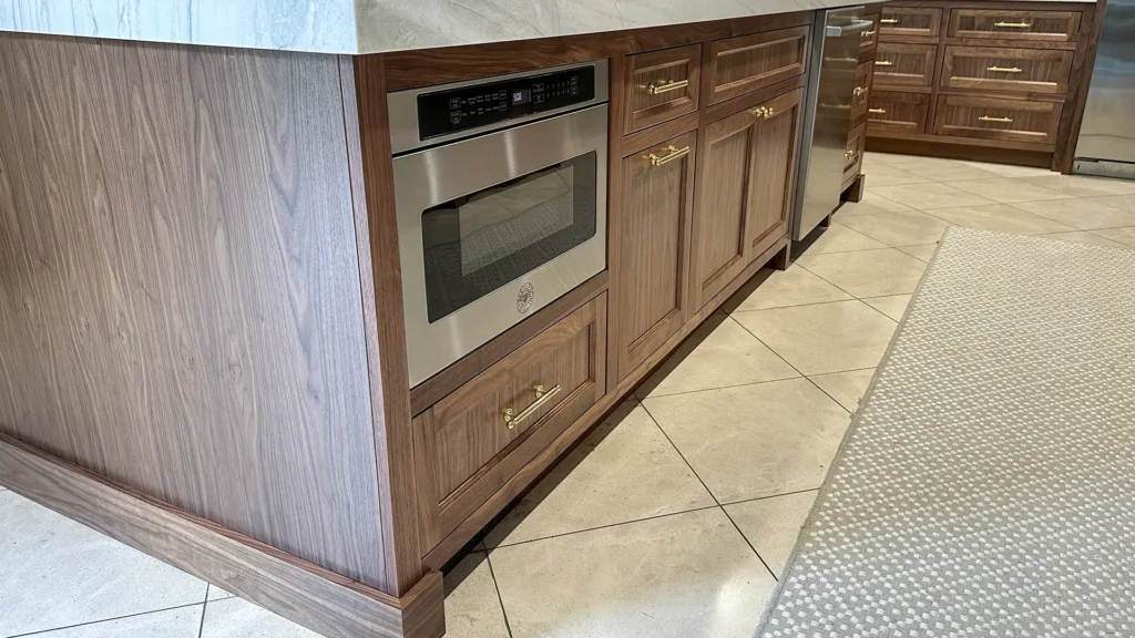 Elegant kitchen remodel featuring detailed millwork and cabinet joinery throughout kitchen and great room in Granite Bay, CA by Tenax Construction