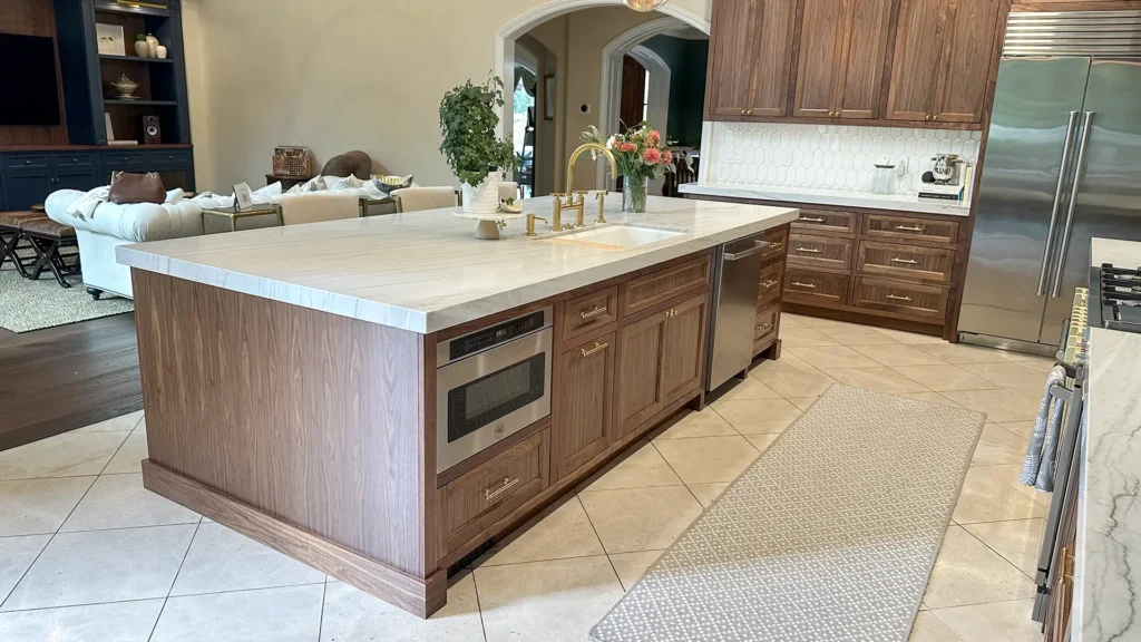 Elegant kitchen remodel featuring expanded kitchen island with 12-inch cabinet addition and bar seating overhang in Granite Bay, CA by Tenax Construction