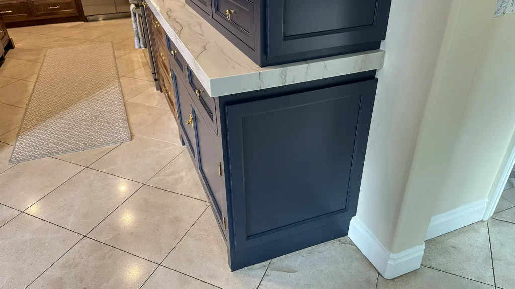 Elegant kitchen remodel featuring glass-front display cabinets with crown molding tied into existing trimwork in Granite Bay, CA by Tenax Construction