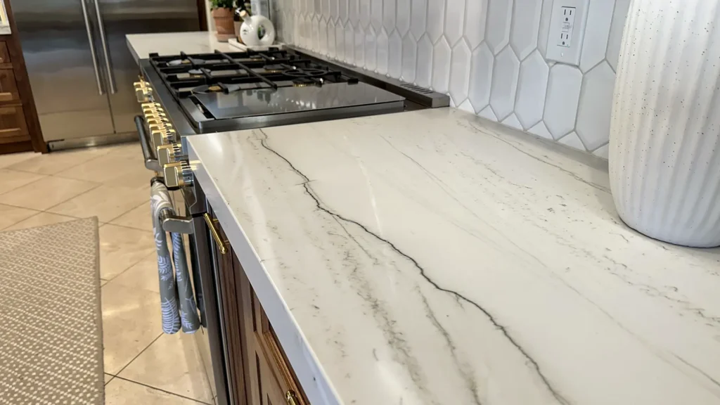 Elegant kitchen remodel featuring completed kitchen with quartz countertops pendant lighting and custom cabinetry in Granite Bay, CA by Tenax Construction