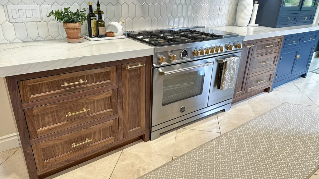 Elegant kitchen remodel featuring redesigned fireplace wall with designer-specified materials and new surround in Granite Bay, CA by Tenax Construction