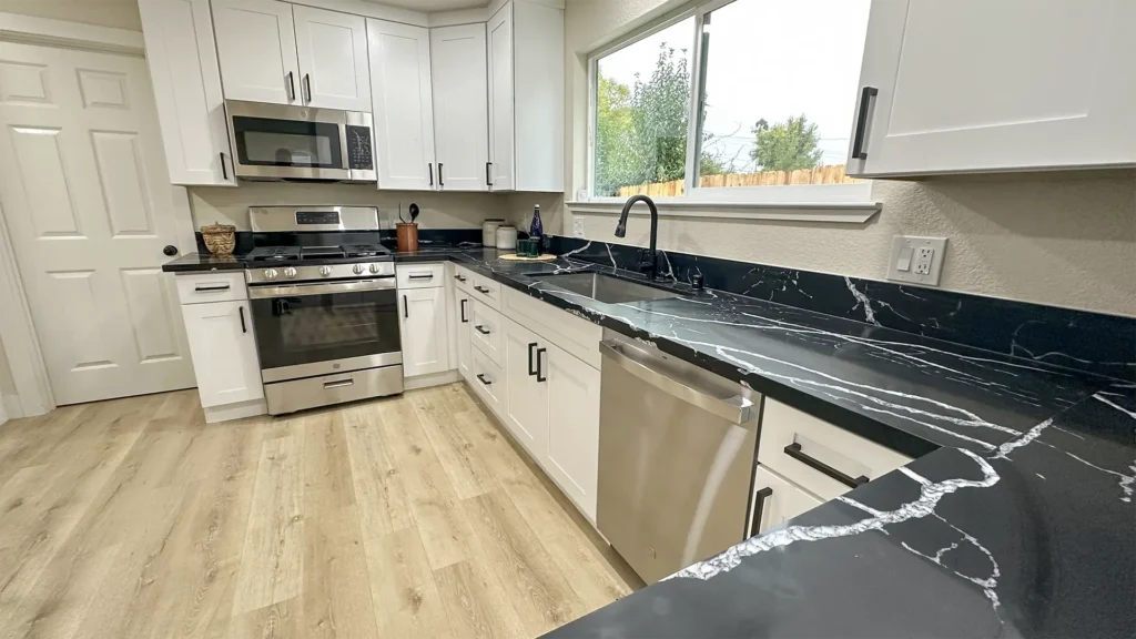 Kitchen remodel featuring installed new appliances connected to updated electrical and plumbing systems in Sacramento, CA by Tenax Construction