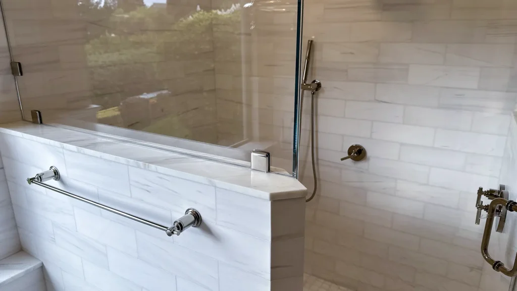 Luxury bathroom remodel featuring light-filled spa retreat with open wet room and glass enclosure in Granite Bay, CA by Tenax Construction