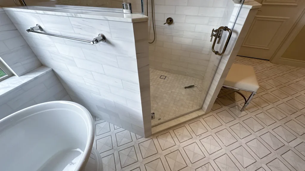 Luxury bathroom remodel featuring natural tone tile on shower walls and bathroom floor in Granite Bay, CA by Tenax Construction