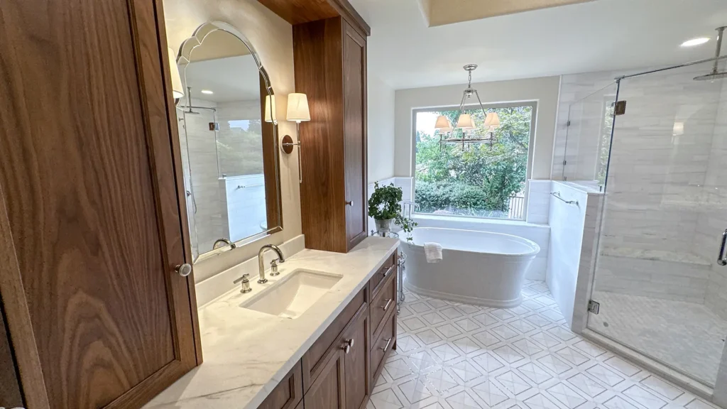Luxury bathroom remodel featuring modern lighting fixtures and hand-selected hardware throughout bathroom in Granite Bay, CA by Tenax Construction
