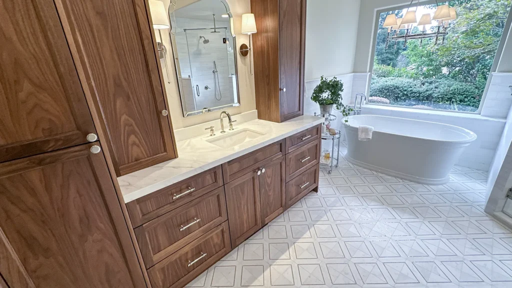 Luxury bathroom remodel featuring freestanding soaking tub with polished fixtures and marble accents in Granite Bay, CA by Tenax Construction