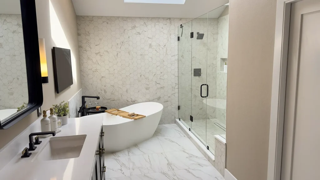 Luxury primary bathroom remodel featuring two-tone paint scheme tying bathroom bedroom and walk-in closet together in Gold River, CA by Tenax Construction