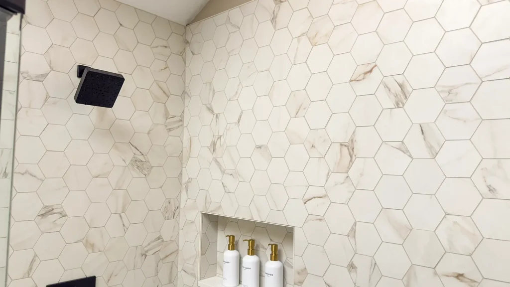 Luxury primary bathroom remodel featuring fully re-routed plumbing lines for freestanding tub and shower system in Gold River, CA by Tenax Construction