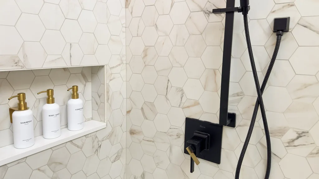 Luxury primary bathroom remodel featuring premium LED can lighting and sconces throughout bathroom in Gold River, CA by Tenax Construction