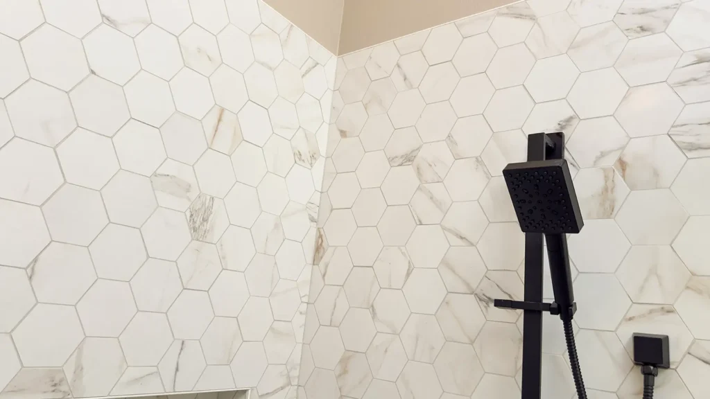 Luxury primary bathroom remodel featuring radiant underfloor heating system for year-round comfort in Gold River, CA by Tenax Construction