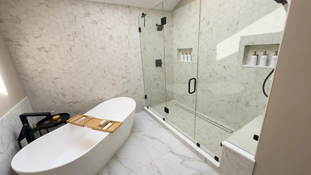 Luxury primary bathroom remodel featuring completed bathroom with freestanding tub vanity and frameless glass shower in Gold River, CA by Tenax Construction