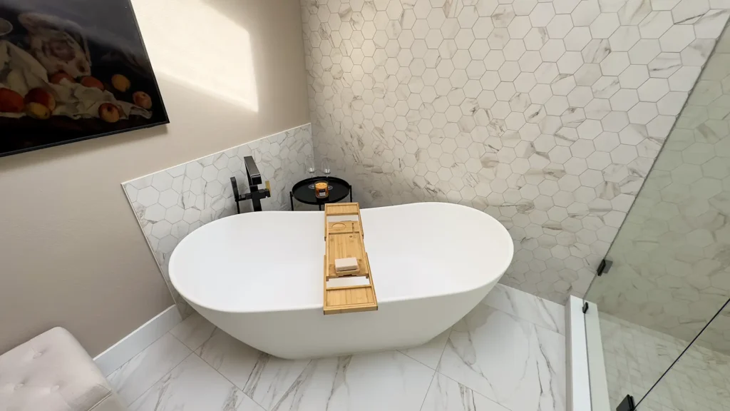 Luxury primary bathroom remodel featuring overall spa-inspired retreat with minimalist luxury design in Gold River, CA by Tenax Construction