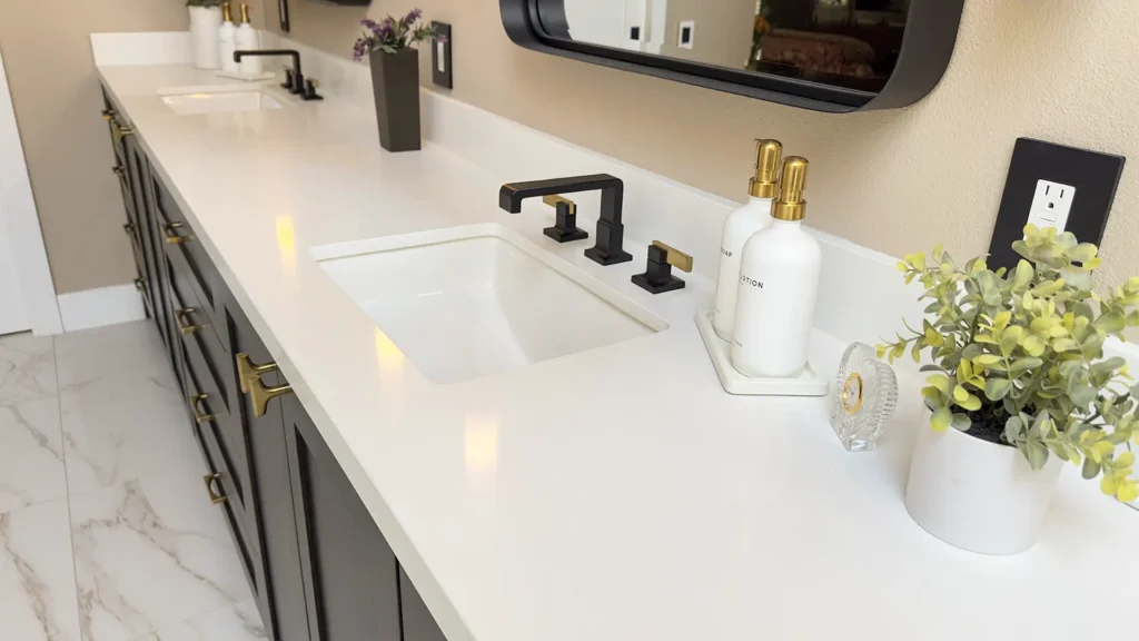 Luxury primary bathroom remodel featuring sleek black fixtures and natural materials for sophisticated contrast in Gold River, CA by Tenax Construction