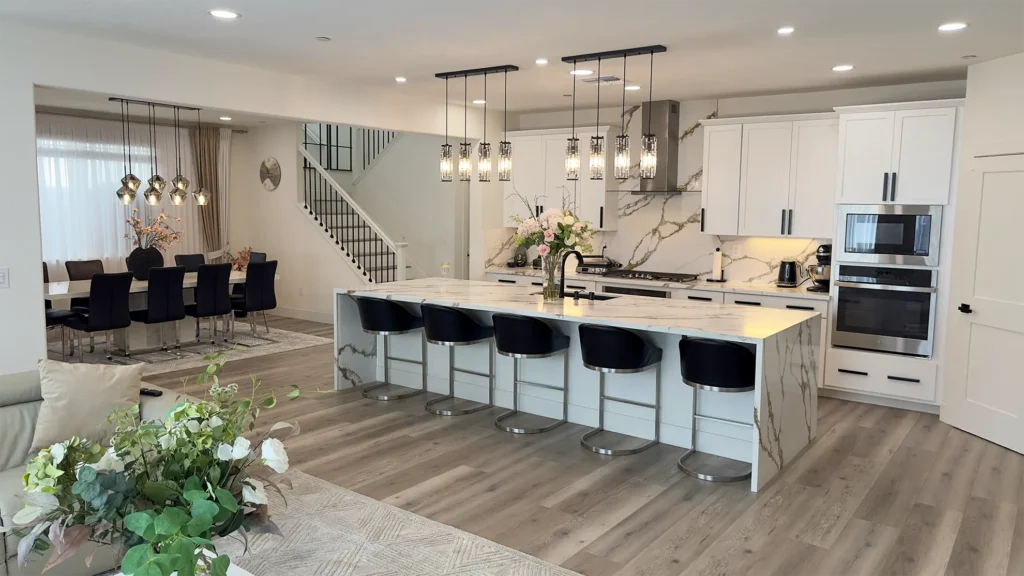 Modern luxury kitchen remodel featuring oversized kitchen island with seating for prep and family gathering in Roseville, CA by Tenax Construction