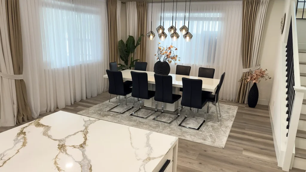 Modern luxury kitchen remodel featuring waterfall-edge countertops with dramatic veining for style and durability in Roseville, CA by Tenax Construction