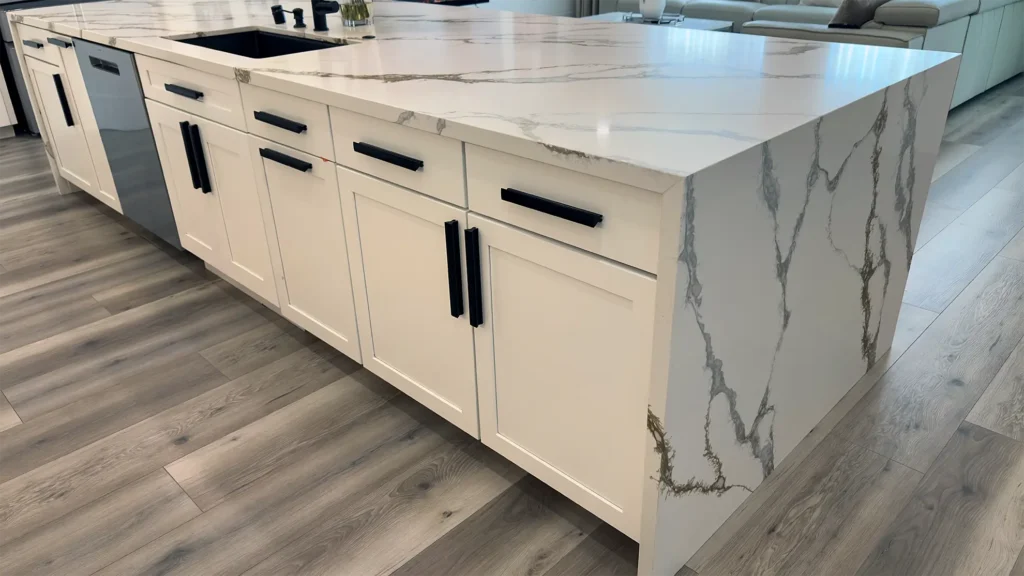 Modern luxury kitchen remodel featuring custom white shaker cabinets with matte black hardware in Roseville, CA by Tenax Construction