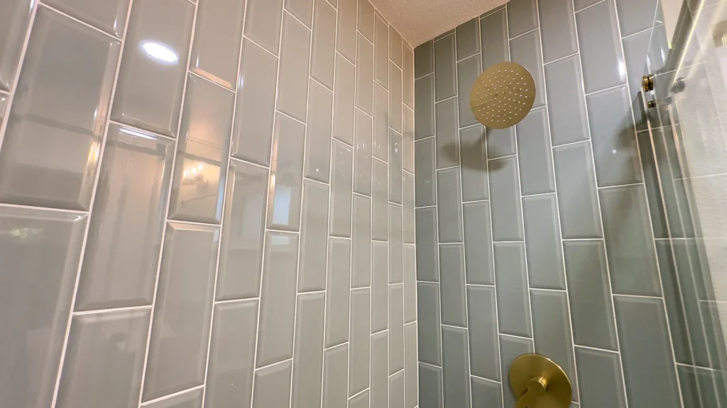 Bathroom remodel featuring barn-style door installation for bathroom closet in primary suite in Fair Oaks, CA by Tenax Construction