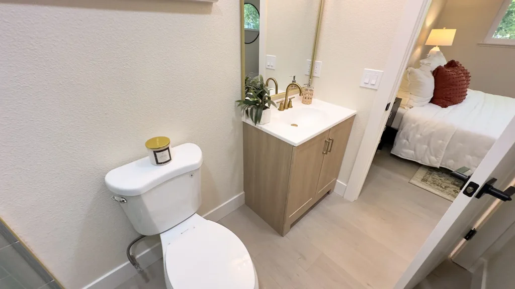 Bathroom remodel featuring low-maintenance quartz wet walls up to 85 inches for high-end look in Fair Oaks, CA by Tenax Construction