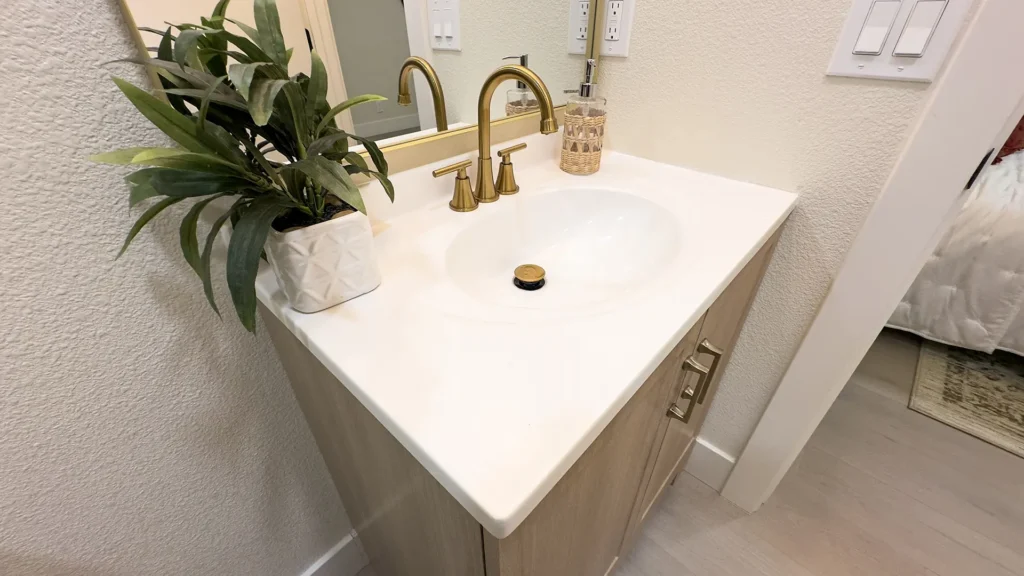 Bathroom remodel featuring remodeled bathroom closet with new shelves rods and bi-fold doors in Fair Oaks, CA by Tenax Construction