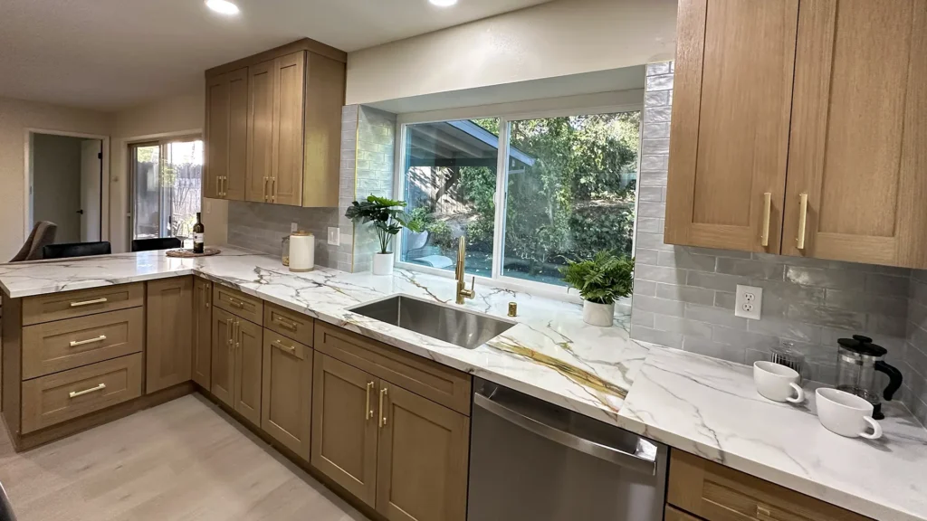 Kitchen remodel featuring code-compliant electrical upgrades with relocated dedicated circuits for major appliances in Fair Oaks, CA by Tenax Construction