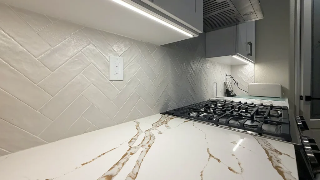 Full kitchen remodel and fireplace conversion featuring TV wall mount with concealed power and low-voltage data connections in Elk Grove, CA by Tenax Construction