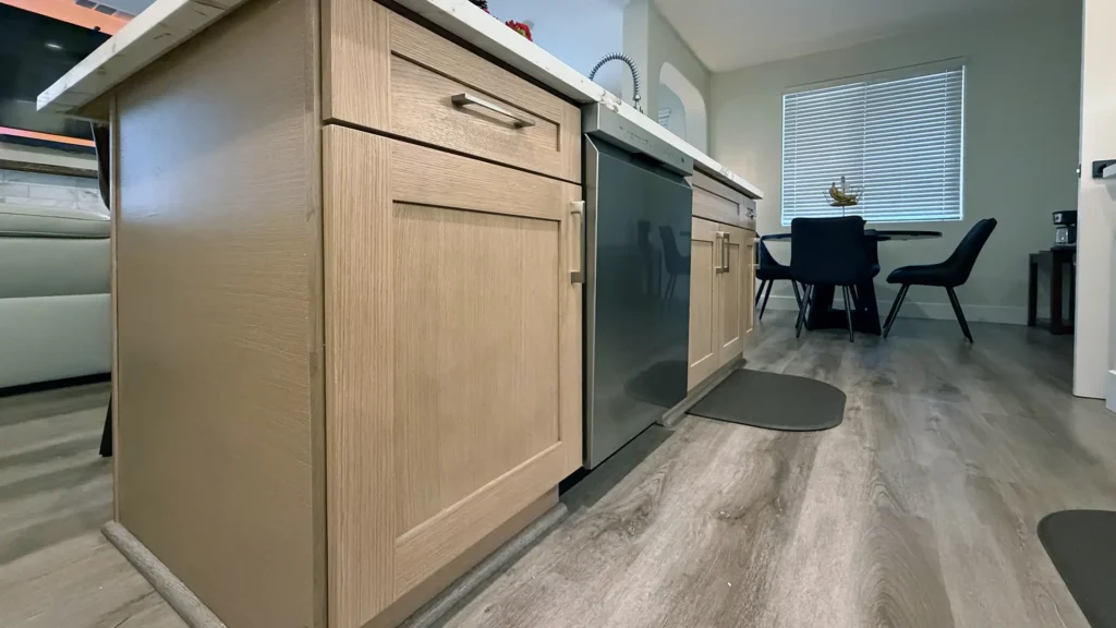 Full kitchen remodel and fireplace conversion featuring gas-to-electric fireplace with new tile surround and mantel in Elk Grove, CA by Tenax Construction