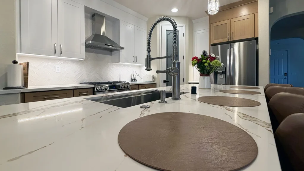 Full kitchen remodel featuring pull-out trays in base cabinets on each side of stove for accessibility in Elk Grove, CA by Tenax Construction