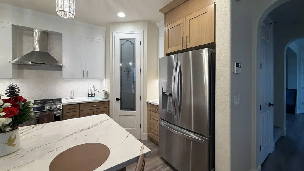 Full kitchen remodel featuring 3 pendant lights on dimmer switch over island for adjustable ambience in Elk Grove, CA by Tenax Construction
