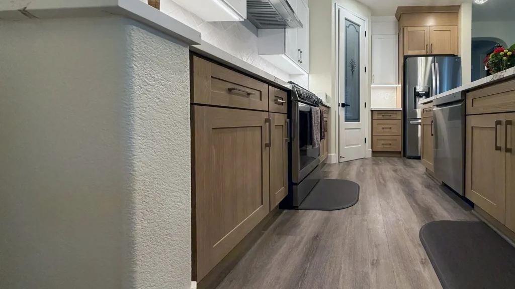 Full kitchen remodel featuring full-height white herringbone tile backsplash extending to ceiling in Elk Grove, CA by Tenax Construction
