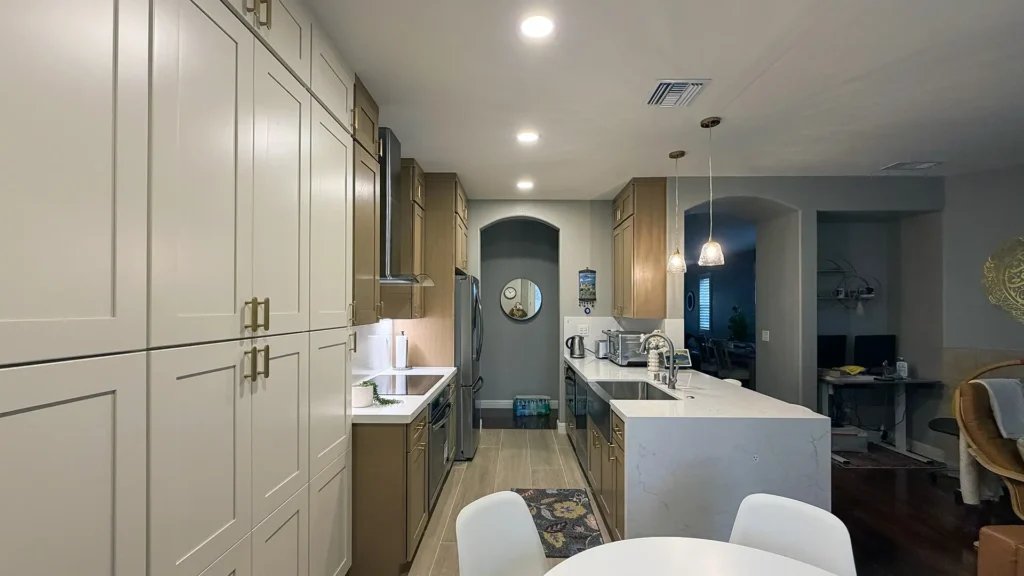 Modern kitchen remodel featuring undermount stainless steel sink with new faucet and soap dispenser in Antelope, CA by Tenax Construction