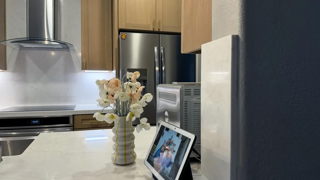 Modern kitchen remodel featuring dust barriers and containment protecting adjacent areas during construction in Antelope, CA by Tenax Construction