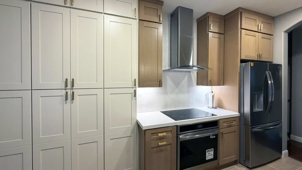 Modern kitchen remodel featuring scribe moldings fillers and crown moldings for seamless integrated cabinet finish in Antelope, CA by Tenax Construction