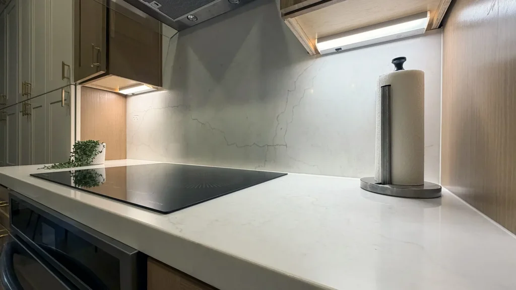 Modern kitchen remodel featuring new garbage disposal with continuous-feed 1/2 HP motor and universal mount in Antelope, CA by Tenax Construction