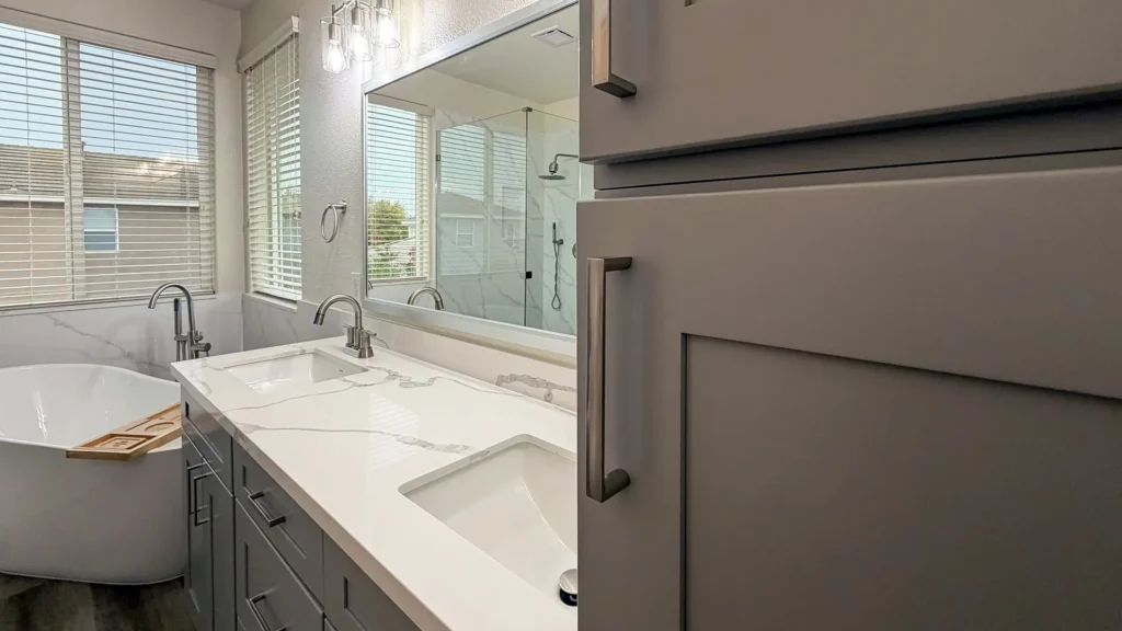 Spa-like master bathroom remodel featuring new shower valve with handheld shower and relocated plumbing layout in Elk Grove, CA by Tenax Construction
