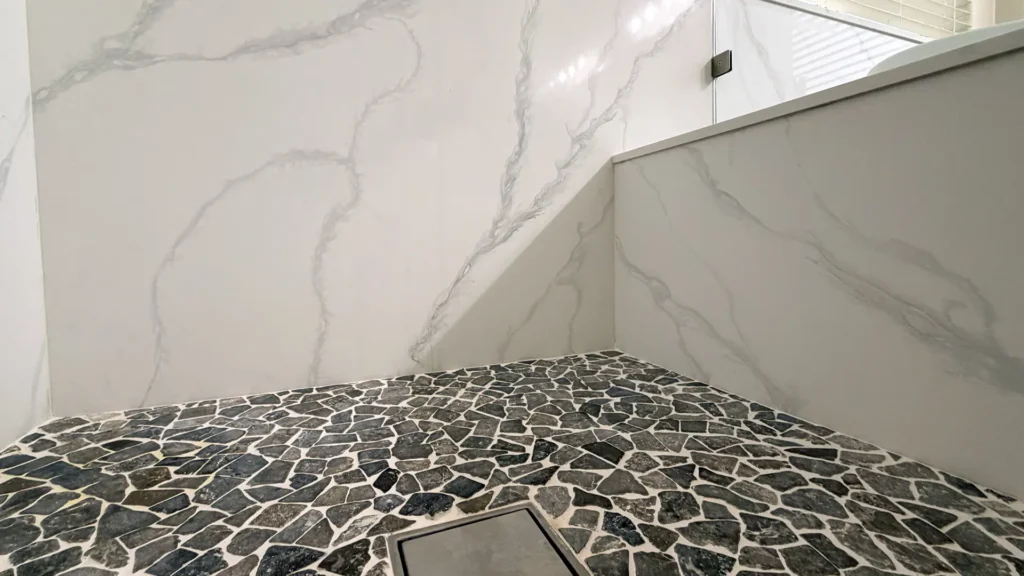 Spa-like master bathroom remodel featuring freestanding 55-inch soaking tub as focal point of bathing area in Elk Grove, CA by Tenax Construction