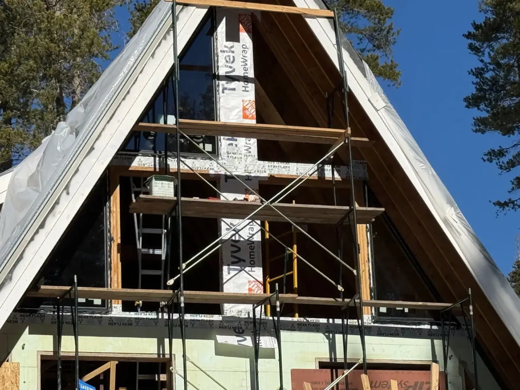 ICF mountain home construction featuring Trex Enhance Naturals composite decking and stainless steel cable railing in Soda Springs, CA by Tenax Construction