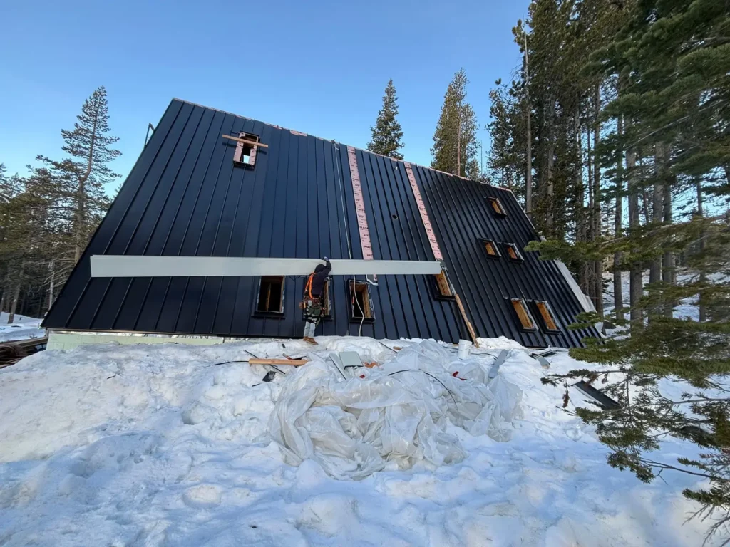 ICF mountain home construction featuring Milgard windows and oversized glass gable for panoramic mountain views in Soda Springs, CA by Tenax Construction