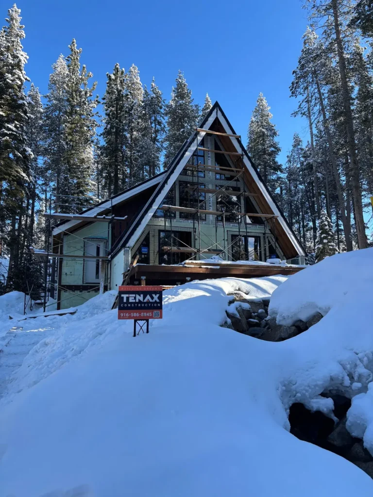 ICF mountain home construction featuring stone accent foundation and modern mountain exterior finish in Soda Springs, CA by Tenax Construction