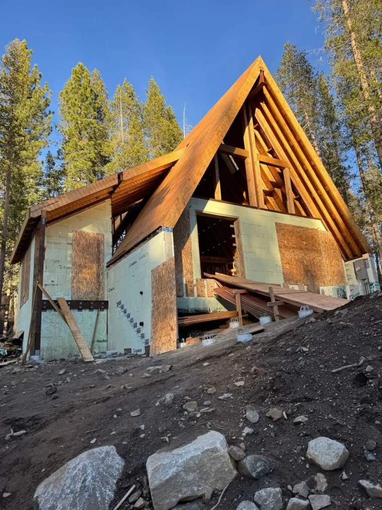 ICF mountain home construction featuring vertical cementitious board and batten siding on exterior in Soda Springs, CA by Tenax Construction