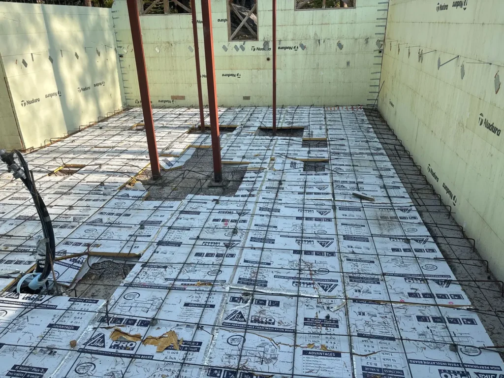 ICF mountain home construction featuring Nudura ICF foundation and structural base on snowy mountain lot in Soda Springs, CA by Tenax Construction