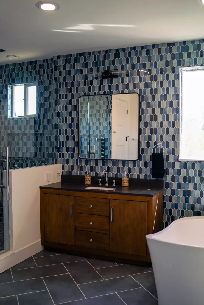 Full bathroom remodel featuring radiant floor heating and full tile installation in master bathroom and laundry area in Sacramento, CA by Tenax Construction
