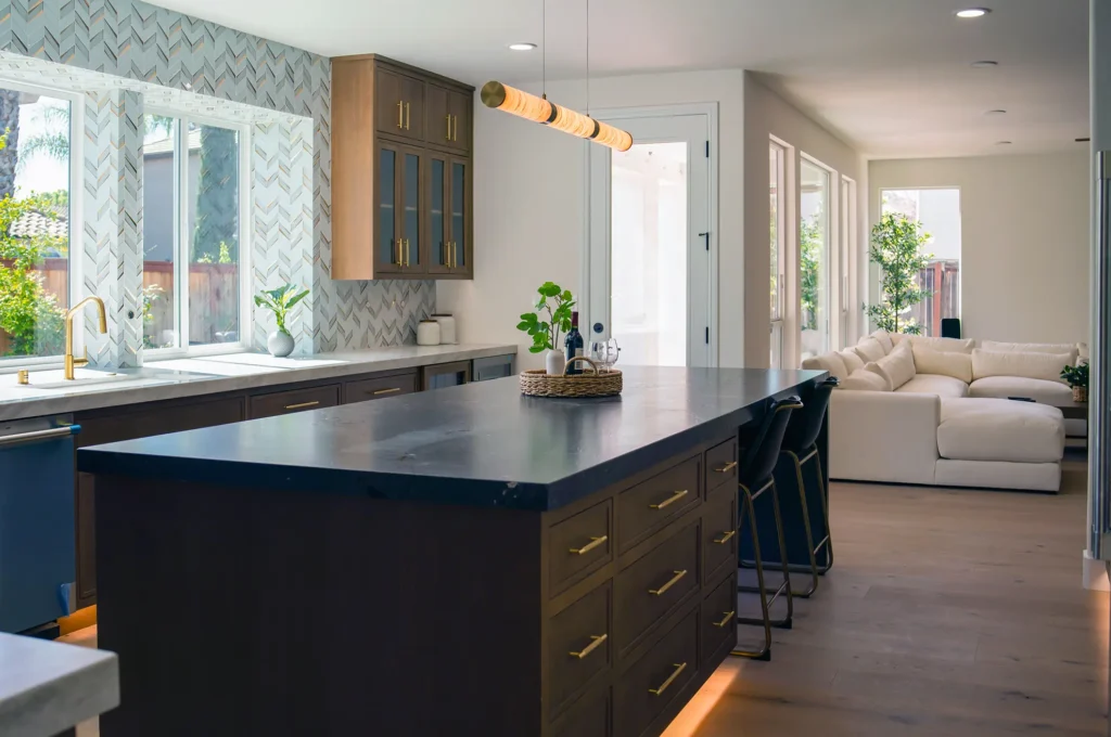 Full kitchen remodel featuring chandelier above kitchen island and HALO recessed can lights in Sacramento, CA by Tenax Construction