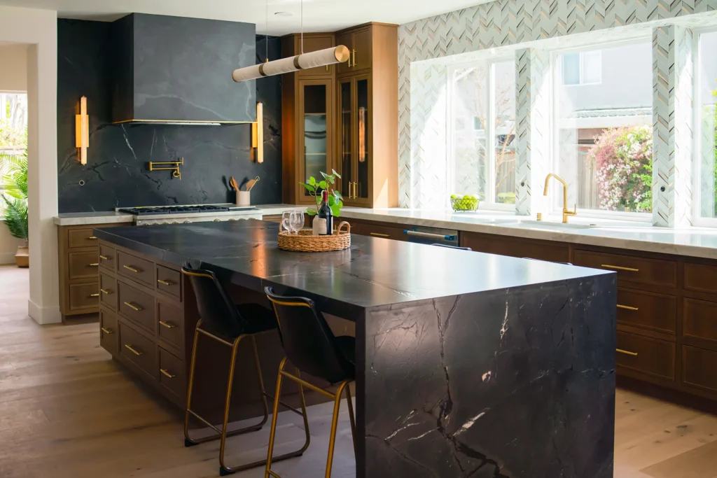 Full kitchen remodel featuring new custom cabinets and stone-look hood frame with skin rock wrap in Sacramento, CA by Tenax Construction