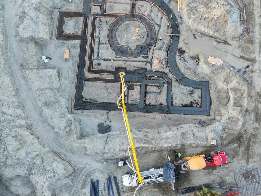 Luxury ICF custom home construction featuring complex rebar grid and multi-zone foundation footprint in Indio, CA by Tenax Construction